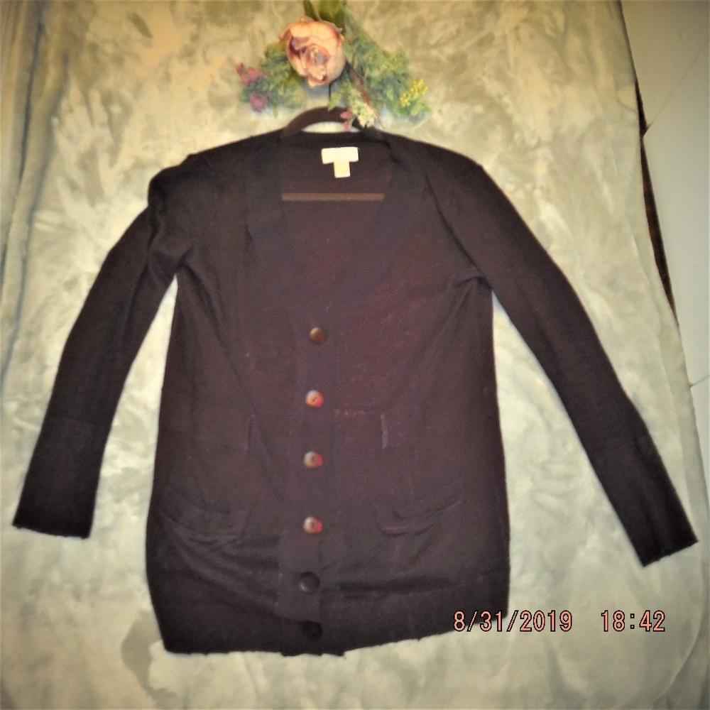 Button down purple long sleeved sweater.